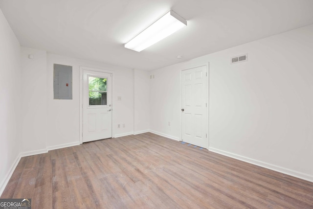 1007 Natalie Ln SE, Smyrna, GA 30082 - unfurnished room featuring baseboards, visible vents, wood finished floors, and electric panel