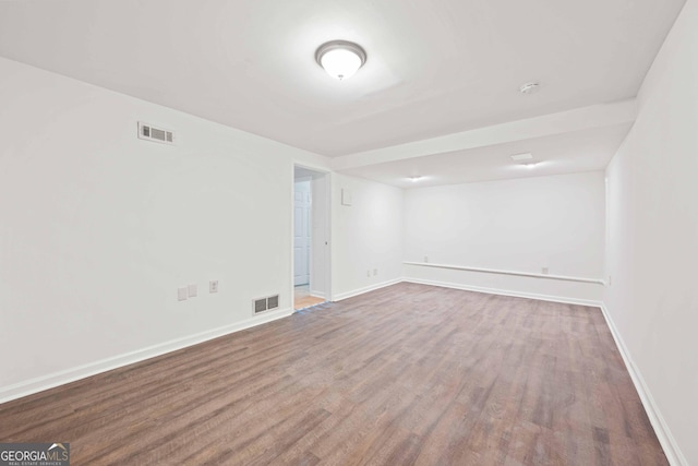 1007 Natalie Ln SE, Smyrna, GA 30082 - spare room featuring baseboards, visible vents, and wood finished floors