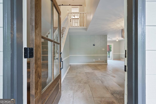 1007 Natalie Ln SE, Smyrna, GA 30082 - foyer entrance with visible vents, baseboards, and stairway