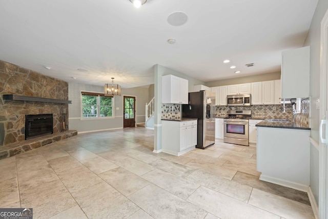 1007 Natalie Ln SE, Smyrna, GA 30082 - kitchen featuring white cabinetry, decorative backsplash, a sink, and dishwasher