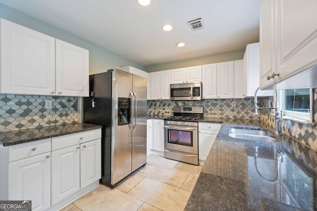1007 Natalie Ln SE, Smyrna, GA 30082 - spare room featuring wood-type flooring, visible vents, a barn door, and plenty of natural light