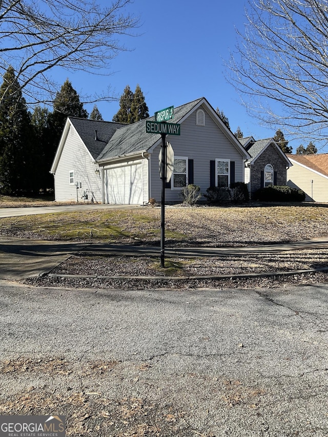 view of front of property with a garage and driveway