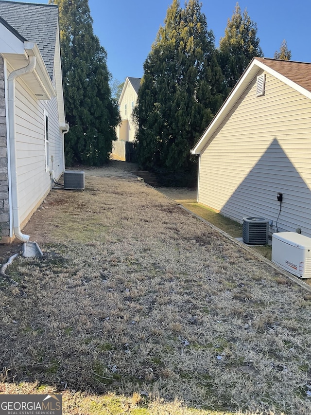 view of yard with central AC