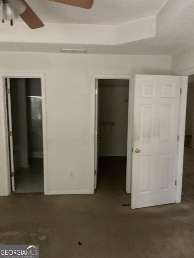 unfurnished bedroom featuring visible vents, a closet, and a spacious closet