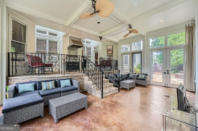 sunroom / solarium with coffered ceiling, beamed ceiling, and french doors