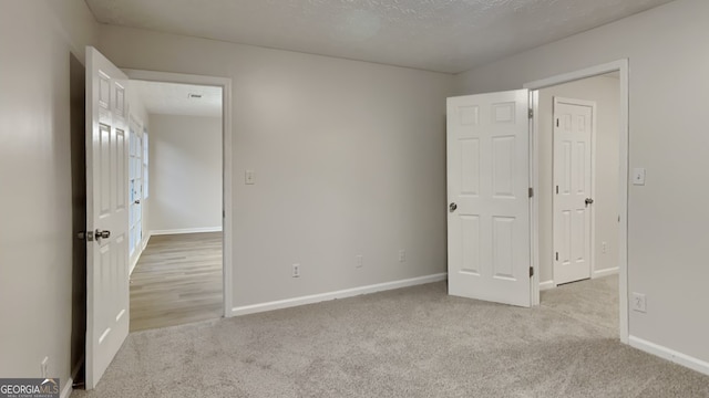 943 Colvin Dr, Locust Grove, GA 30248 - unfurnished bedroom featuring baseboards and carpet
