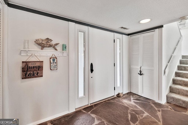 202 Providence Villas, Anderson, SC 29626 - entryway with stairway, a textured ceiling, and visible vents