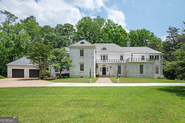 1464 Twin Pines Dr, Macon, GA 31211 - view of front of home featuring driveway, a chimney, a balcony, and a front lawn