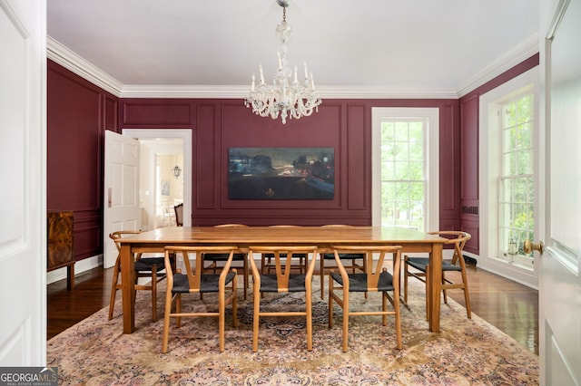 1464 Twin Pines Dr, Macon, GA 31211 - dining space featuring an inviting chandelier, a decorative wall, and wood finished floors