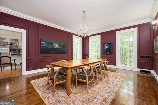 1464 Twin Pines Dr, Macon, GA 31211 - dining space with an inviting chandelier, crown molding, and a decorative wall