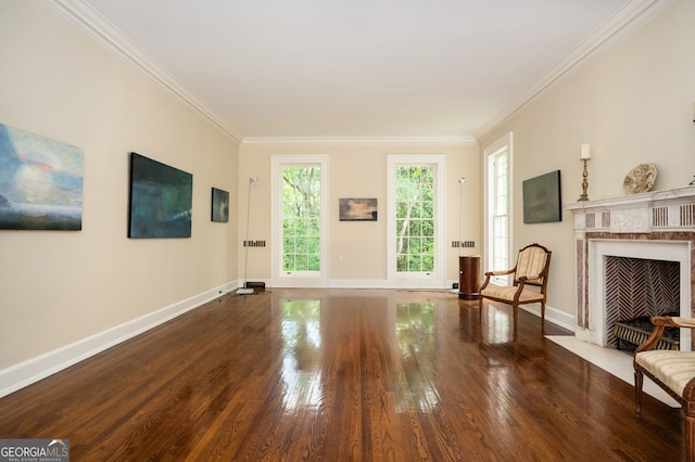 1464 Twin Pines Dr, Macon, GA 31211 - unfurnished living room featuring baseboards, ornamental molding, and wood finished floors