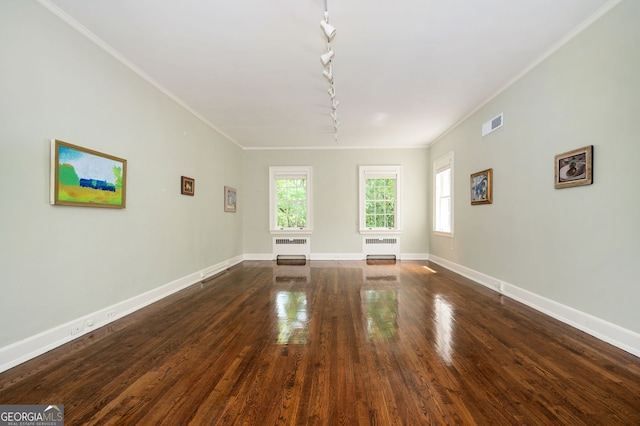 1464 Twin Pines Dr, Macon, GA 31211 - unfurnished living room featuring plenty of natural light, rail lighting, radiator heating unit, and ornamental molding