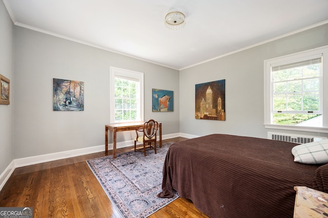 1464 Twin Pines Dr, Macon, GA 31211 - bedroom with baseboards, radiator, crown molding, and wood finished floors
