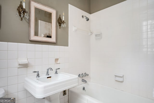 1464 Twin Pines Dr, Macon, GA 31211 - bathroom with a sink, washtub / shower combination, toilet, and tile walls