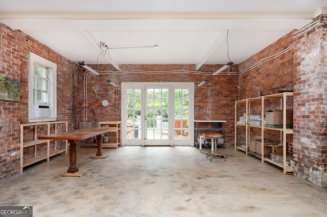 1464 Twin Pines Dr, Macon, GA 31211 - miscellaneous room with brick wall and a wealth of natural light