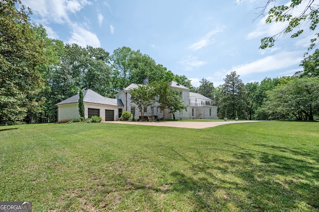 1464 Twin Pines Dr, Macon, GA 31211 - view of front of house with a patio, a garage, a front lawn, and driveway