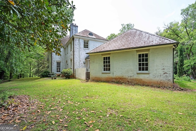1464 Twin Pines Dr, Macon, GA 31211 - rear view of property with a lawn, brick siding, a high end roof, and a chimney