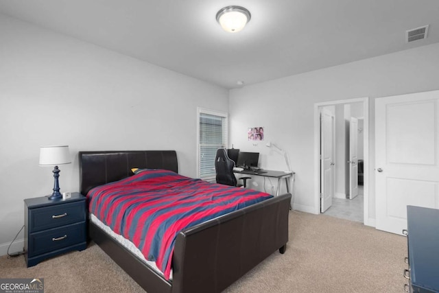 bedroom featuring baseboards, visible vents, and carpet