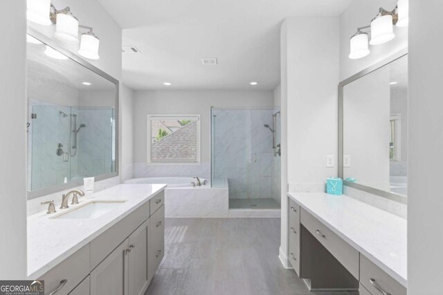 full bath featuring a garden tub, vanity, visible vents, recessed lighting, and a shower stall