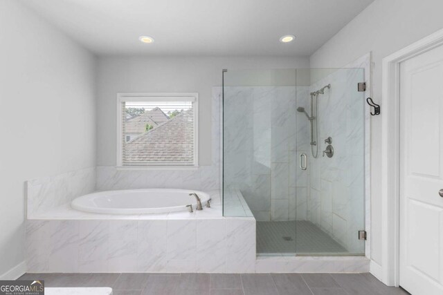 full bathroom with recessed lighting, tile patterned floors, a shower stall, and a bath