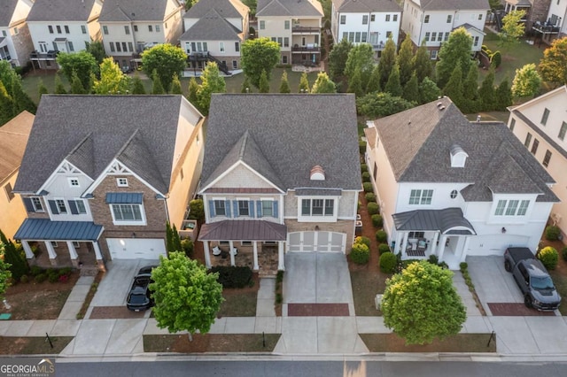 birds eye view of property with a residential view