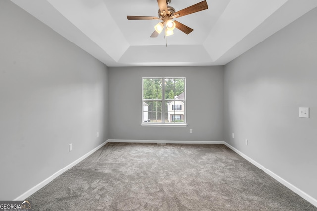 5452 Sweetsprings Dr SW, Powder Springs, GA 30127 - spare room with carpet flooring, a tray ceiling, baseboards, and ceiling fan
