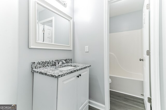 5452 Sweetsprings Dr SW, Powder Springs, GA 30127 - bathroom featuring wood finished floors and vanity
