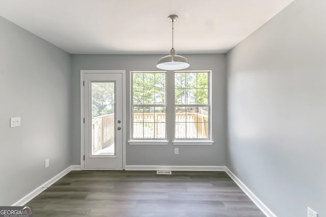 5452 Sweetsprings Dr SW, Powder Springs, GA 30127 - unfurnished dining area featuring baseboards, dark wood finished floors, and visible vents