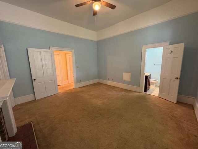 589 Meigs St, Athens, GA 30601 - unfurnished bedroom featuring a ceiling fan, baseboards, carpet, and ensuite bath