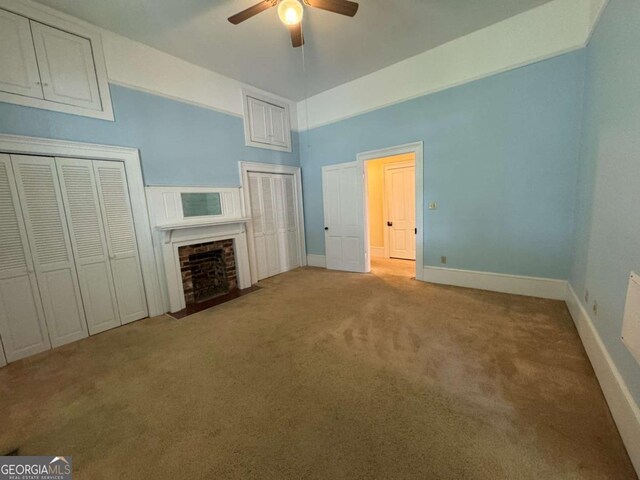 589 Meigs St, Athens, GA 30601 - unfurnished living room featuring carpet floors, a ceiling fan, baseboards, and a fireplace with flush hearth