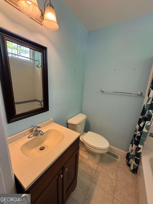 589 Meigs St, Athens, GA 30601 - full bath featuring tile patterned flooring, visible vents, toilet, and vanity