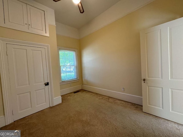589 Meigs St, Athens, GA 30601 - unfurnished bedroom with light colored carpet, baseboards, and ceiling fan
