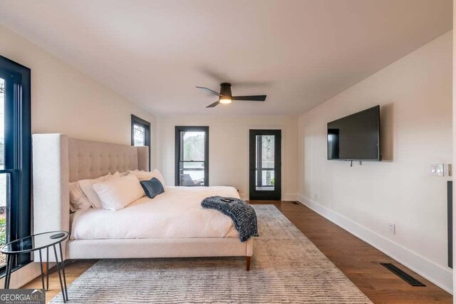 321 Fausetts Lake Rd, Dawsonville, GA 30534 - bedroom featuring baseboards, visible vents, ceiling fan, and dark wood-type flooring