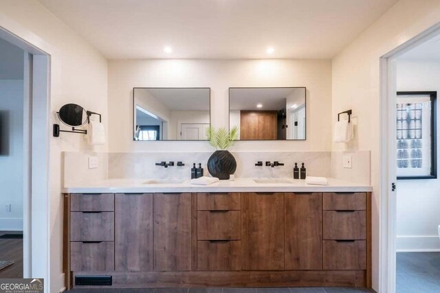321 Fausetts Lake Rd, Dawsonville, GA 30534 - bathroom with double vanity, tasteful backsplash, a sink, and visible vents