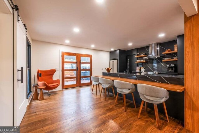 321 Fausetts Lake Rd, Dawsonville, GA 30534 - bar with high end refrigerator, wood finished floors, recessed lighting, wall chimney exhaust hood, and a sink