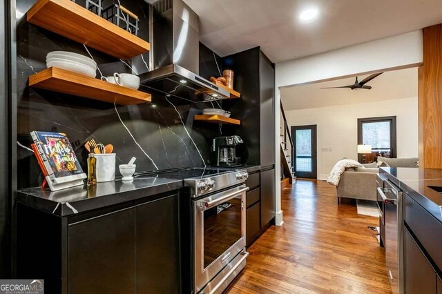 321 Fausetts Lake Rd, Dawsonville, GA 30534 - kitchen featuring wall chimney range hood, open shelves, dark cabinets, stainless steel appliances, and decorative backsplash
