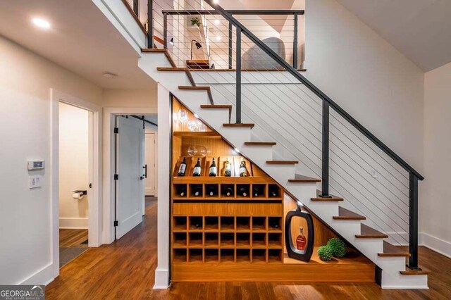 321 Fausetts Lake Rd, Dawsonville, GA 30534 - stairway featuring baseboards and wood finished floors