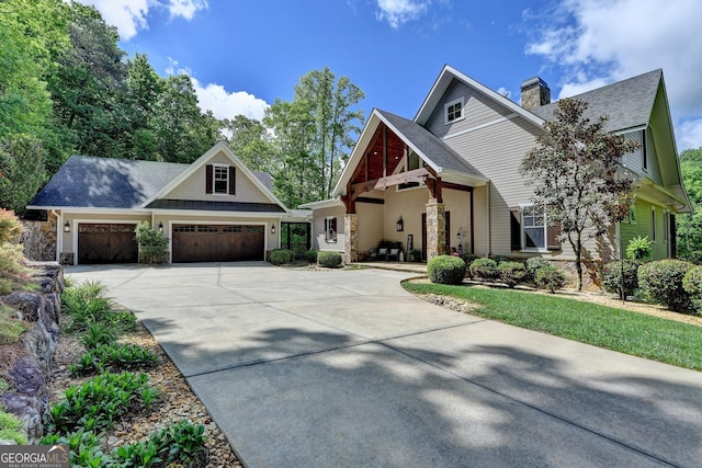 676 N Shore Dr, Cleveland, GA 30528 - craftsman inspired home featuring a chimney, an attached garage, concrete driveway, a shingled roof, and stone siding