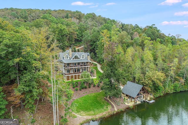 aerial view featuring a water view and a view of trees