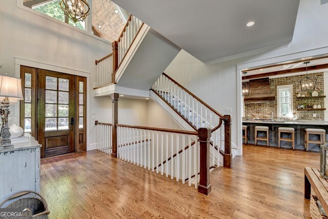 676 N Shore Dr, Cleveland, GA 30528 - entrance foyer with wood finished floors, a chandelier, recessed lighting, and stairs