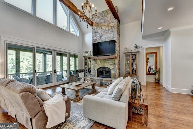 676 N Shore Dr, Cleveland, GA 30528 - living area featuring french doors, high vaulted ceiling, a chandelier, wood finished floors, and baseboards