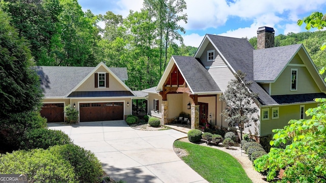 676 N Shore Dr, Cleveland, GA 30528 - craftsman inspired home featuring concrete driveway, a garage, roof with shingles, a chimney, and stone siding