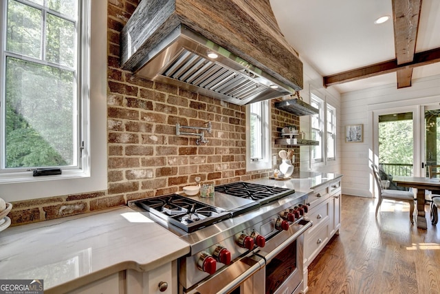 676 N Shore Dr, Cleveland, GA 30528 - kitchen featuring range with two ovens, premium range hood, wood finished floors, white cabinets, and beam ceiling