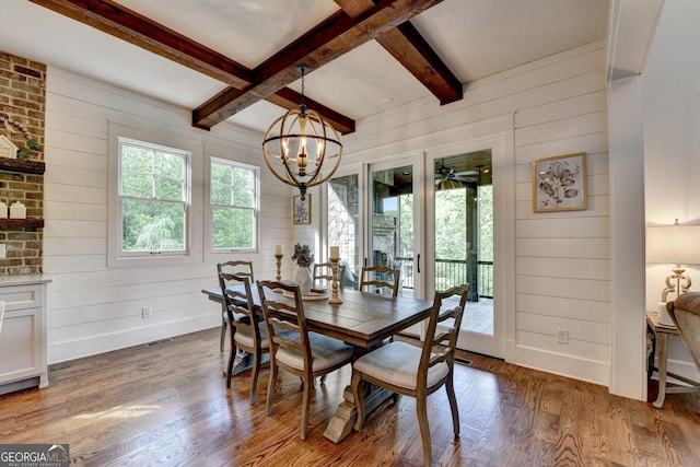 676 N Shore Dr, Cleveland, GA 30528 - dining room featuring wood walls, beamed ceiling, wood finished floors, a chandelier, and baseboards