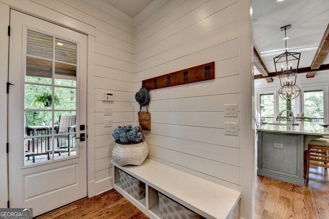 676 N Shore Dr, Cleveland, GA 30528 - mudroom featuring a chandelier, wood finished floors, wood walls, and beamed ceiling