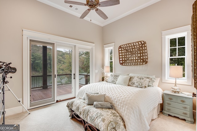 bedroom featuring multiple windows, visible vents, access to exterior, ornamental molding, and light carpet