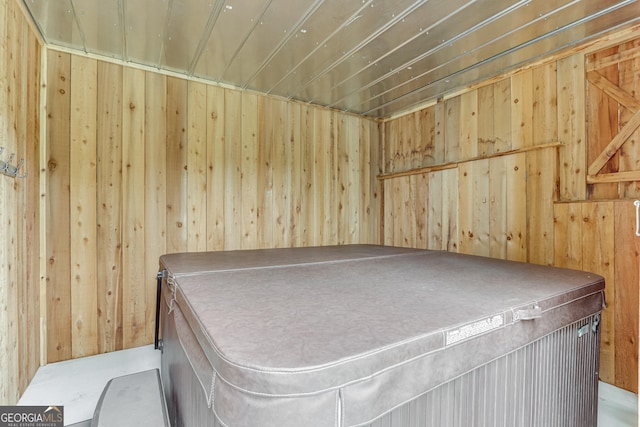 interior space featuring wooden walls