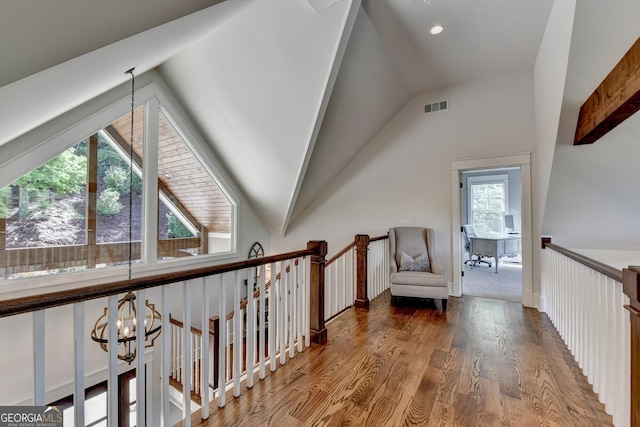 676 N Shore Dr, Cleveland, GA 30528 - hallway featuring vaulted ceiling, wood finished floors, an upstairs landing, a chandelier, and recessed lighting