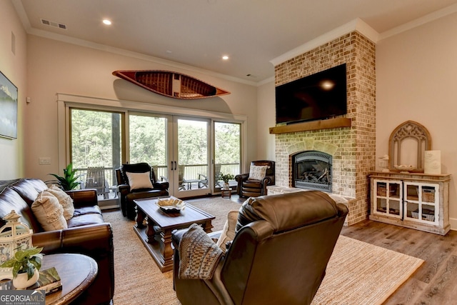 676 N Shore Dr, Cleveland, GA 30528 - living area with a fireplace, ornamental molding, wood finished floors, and recessed lighting