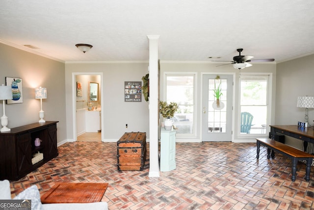 1737 Green Acres Dr, Vidalia, GA 30474 - foyer entrance with crown molding, brick floor, a ceiling fan, and visible vents